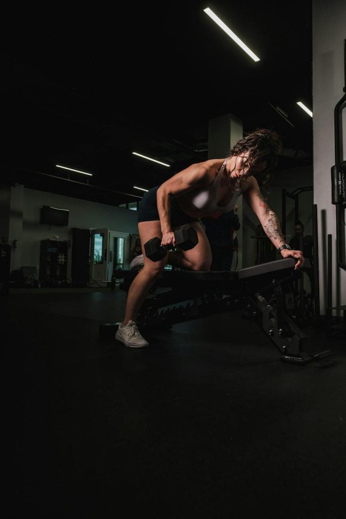 woman lifting a dumbbell