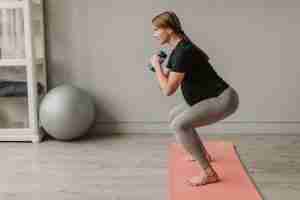 pregnant woman performing squat exercise