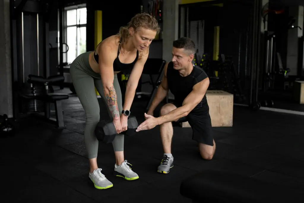 Personal trainer coaching a client